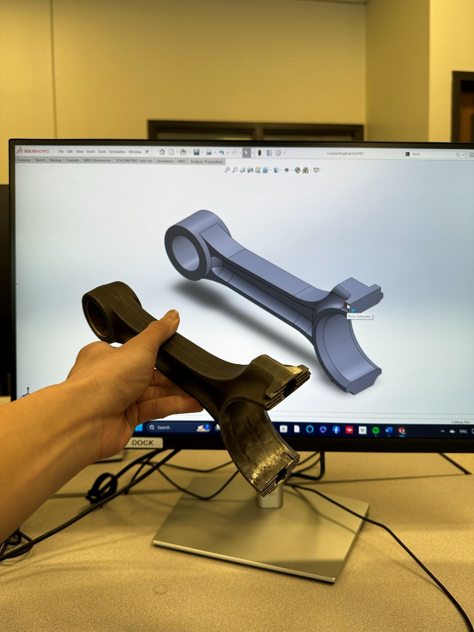 The physical rod beside its SolidWorks model.