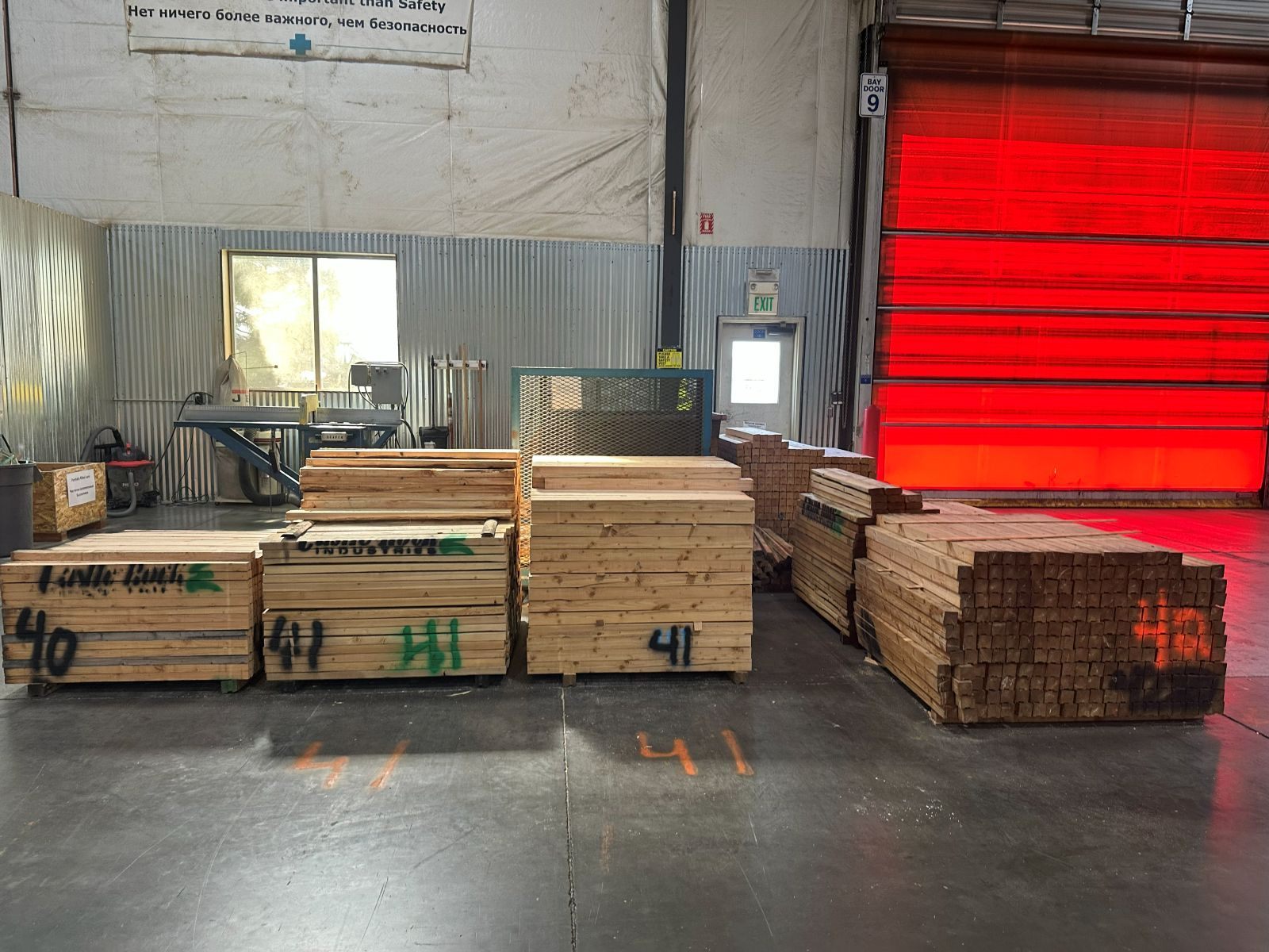 Packaging lumber, sorted and labelled by length.